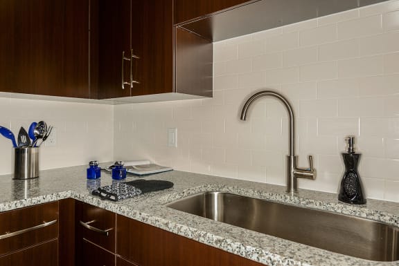 a kitchen with a sink and a faucet  at Azura, Miami, FL, 33186