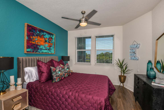 a bedroom with a bed and a ceiling fan at The Exchange, Florida