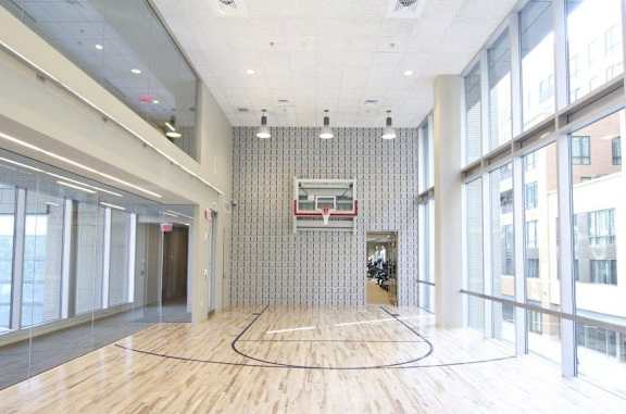 a large room with a basketball hoop in the middle of it