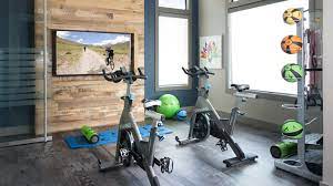 a gym with a bunch of exercise bikes in it