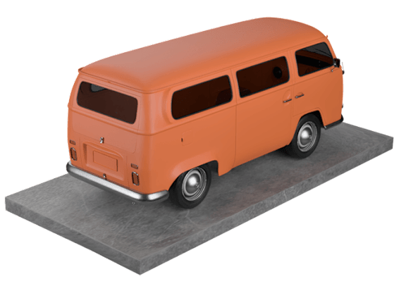 An orange Volkswagen van is parked on a grey surface.