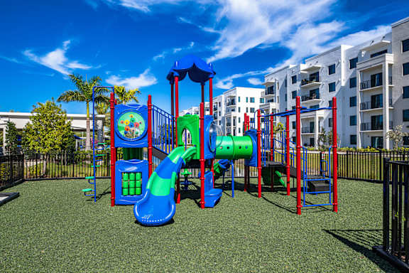 A Playground with a Blue Slide at The Palmeri Residences, Naples, 34104