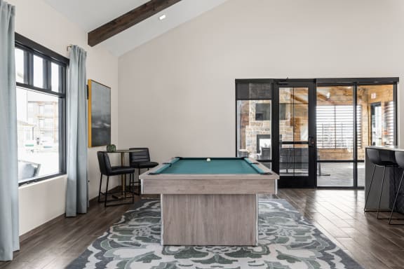 a pool table in the clubhouse at Apex apartments in Colorado Springs