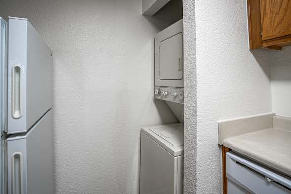 A white fridge and dishwasher in a kitchen.