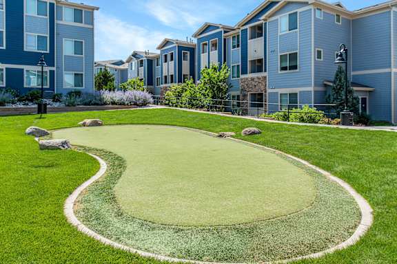 A grassy area with a white border around a green area.