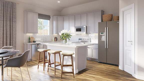 A modern kitchen with a dining table and chairs.