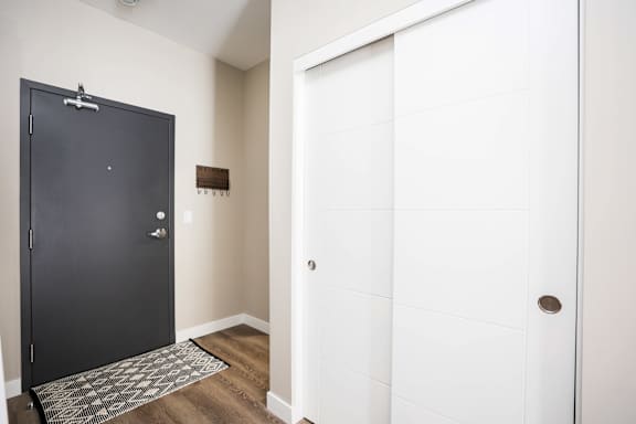 A black door is on the left and a white door is on the right.