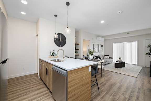 an open floor plan with an island kitchen and living room