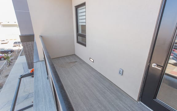 A room with a window and a wall-mounted air conditioner.