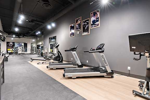 A gym with treadmills and exercise equipment.at Raymond Block, Edmonton, T6E 3R7