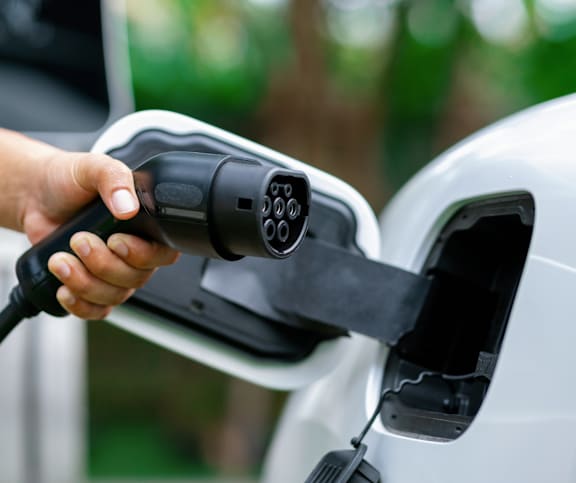 Electric vehicle charging station with connector at Mac and Mullen Apartments, Alberta, T6R 0S7