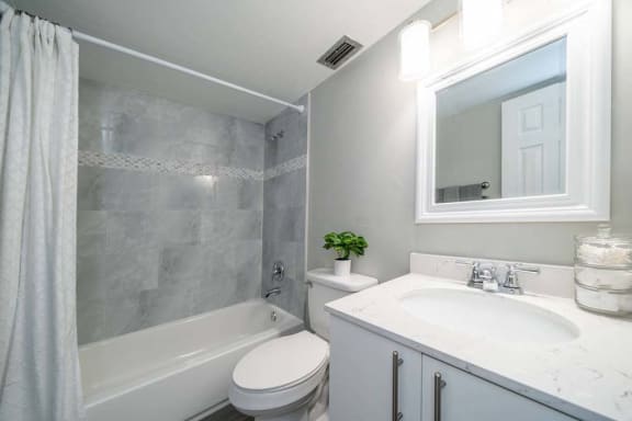 a bathroom with a sink toilet and bathtub at Piper Village West, Florida