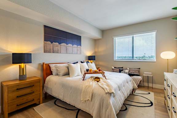 A bedroom with a large bed and a window.at Icon One, Daytona Beach, FL, 32114