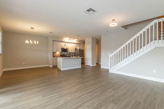 Spacious Unfurnished Living room with staircase at The Falls of Portofino , Florida