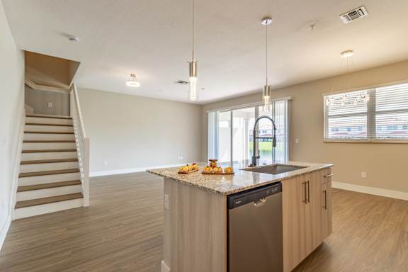 Kitchen with sink at The Falls of Portofino , Naples, FL