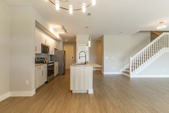 Spacious room and kitchen view at The Falls of Portofino , Florida