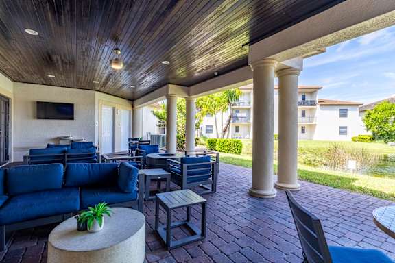 Patio with blue chairs at Portofino Cove, Fort Myers, Florida