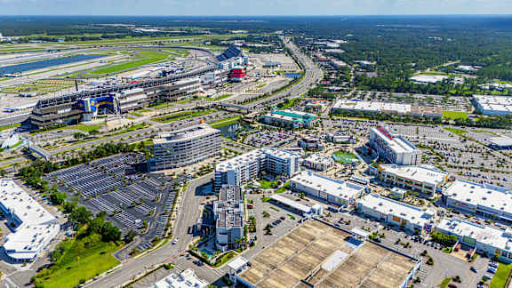 A large aerial view of a city with buildings, roads, and a body of water.at Icon One, Daytona Beach, Florida
