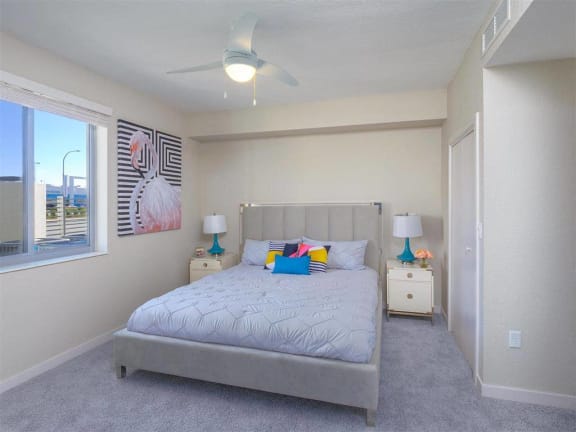 a bedroom with a bed and a ceiling fan at Icon One, Daytona Beach, FL
