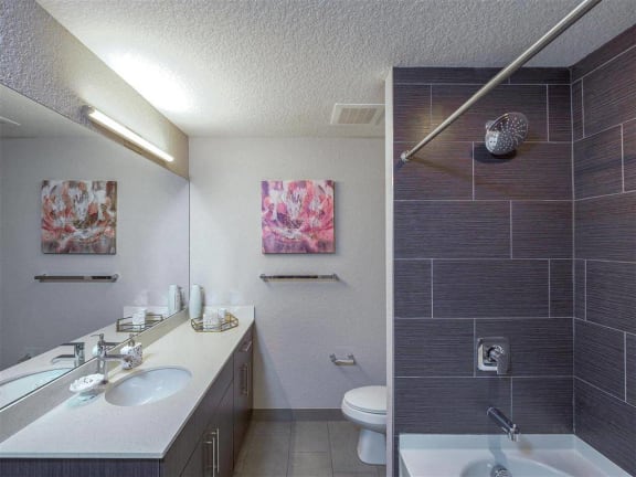 a bathroom with a sink and a toilet and a shower at Icon One, Florida, 32114