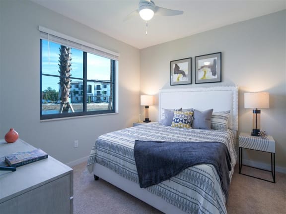a bedroom with a bed and a window