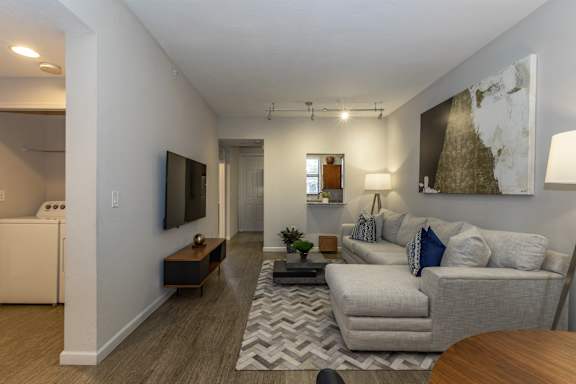 Living room with modern TV at Portofino Cove, Fort Myers, FL, 33916