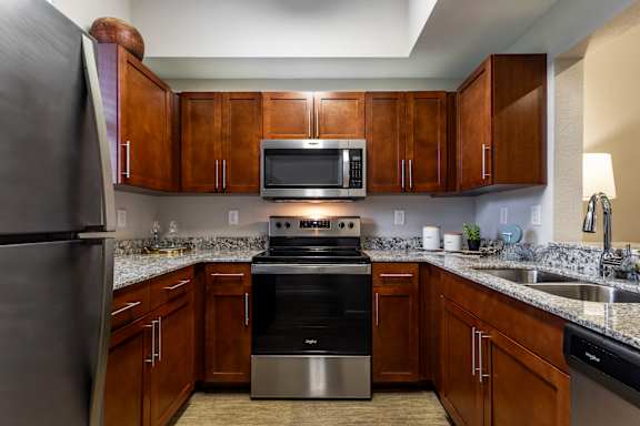 Kitchen with wooden cabinets at Portofino Cove, Fort Myers