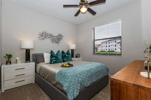 Bedroom with ceiling fan at Portofino Cove, Fort Myers, Florida