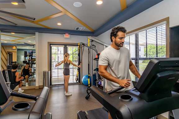 Man working out on treadmill at Portofino Cove, Fort Myers, 33916
