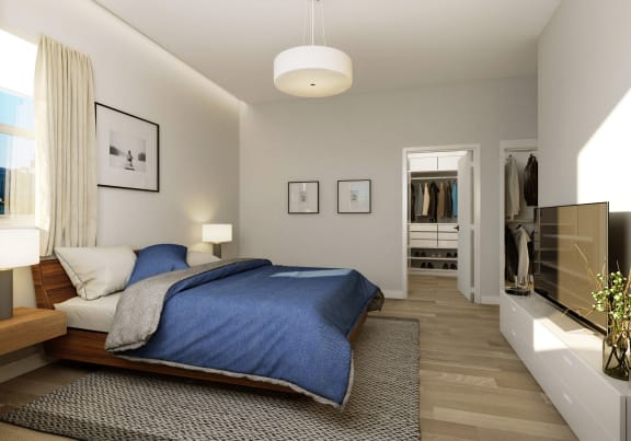 a bedroom with a bed and a tv