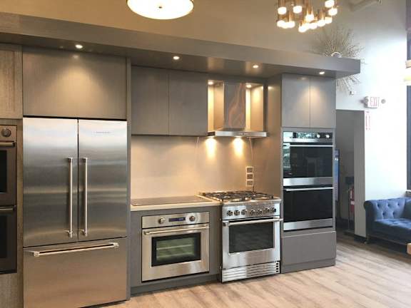 a large stainless steel kitchen with stainless steel appliances