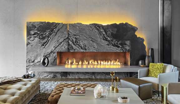 a living room with a fireplace and a large black and white fireplace