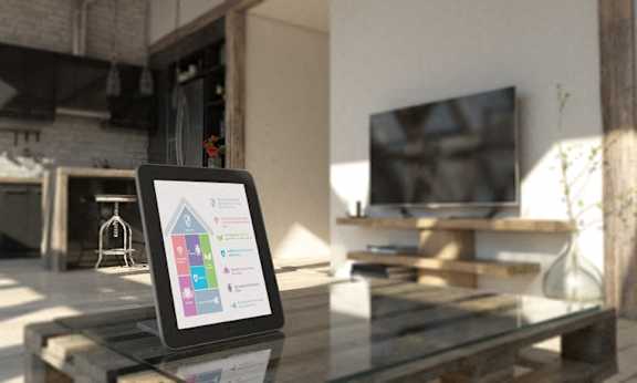a tablet sitting on a table in a living room