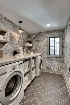 a laundry room with a washing machine and a window