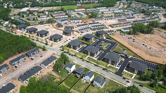 an aerial view of a city with buildings and roads