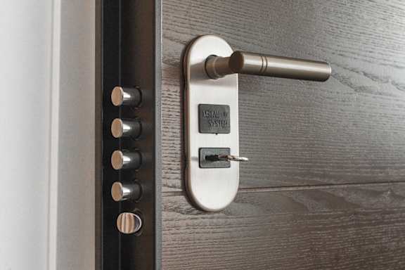 a close up of a door handle with a key in it