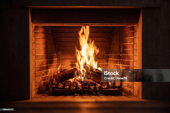 a roaring fire in a brick fireplace