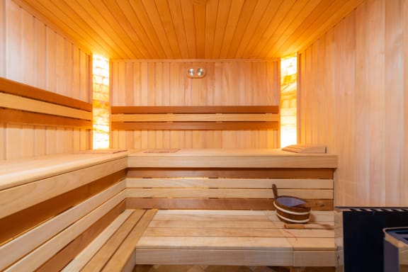 the interior of a sauna in a wood paneled room