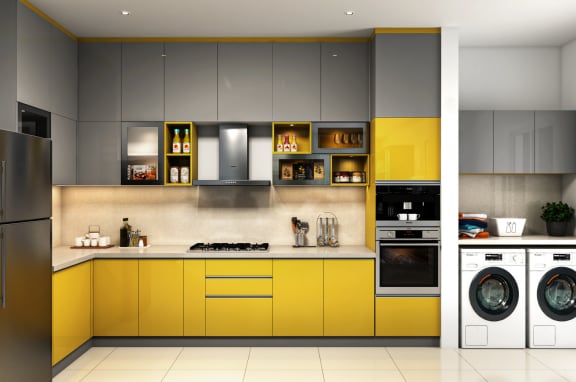 a kitchen with grey and yellow cabinetry and a yellow and white washer and dryer