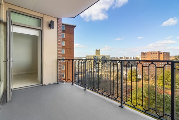 a balcony with a door and a view of the city at HIGHGROVE, Stamford, 06901