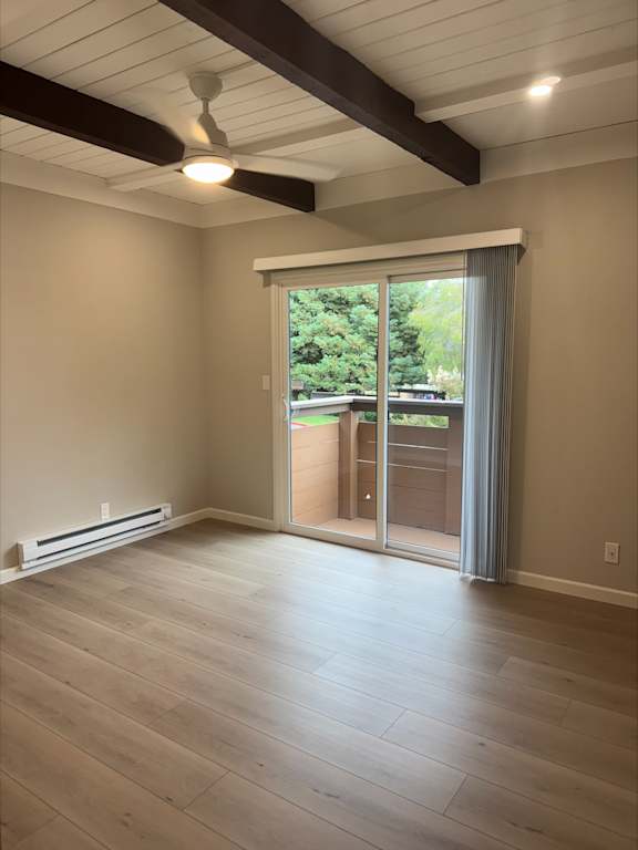 Bedroom with wood floor and deck