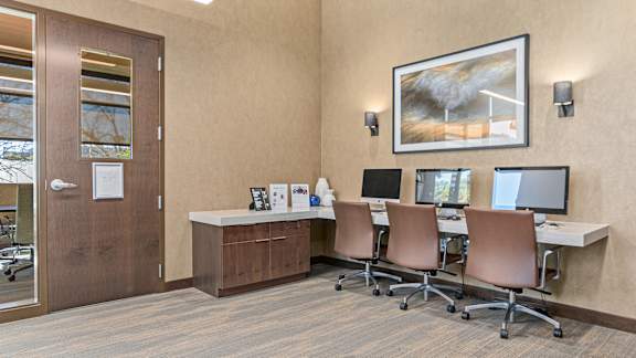 Business center with desk, chair and table at 71 France, Edina, MN