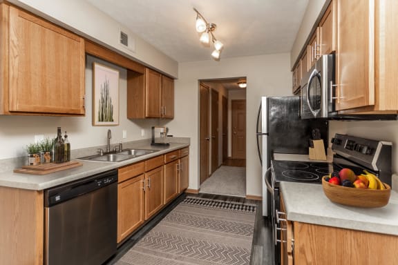 Bright kitchen with classic finishes and stainless steel appliances.