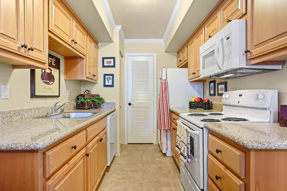 Fully Equipped Kitchen Includes Frost-Free Refrigerator, Electric Range, & Dishwasher at Clayton Creek Apartments, Concord, CA, 94521