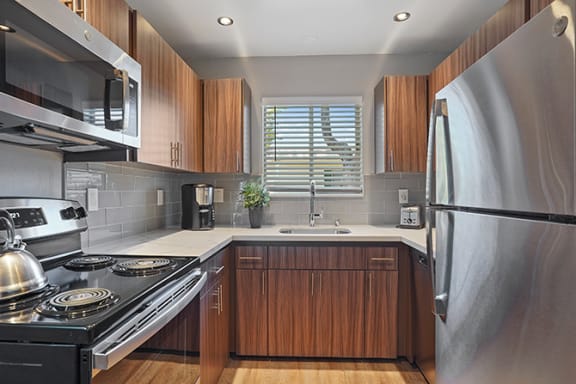 Refrigerator And Kitchen Appliances at Colonial Garden Apartments, California