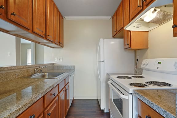 Fully Equipped Kitchen Includes Frost-Free Refrigerator, Electric Range, &amp; Dishwasher at Fairmont Apartments, Pacifica, 94044