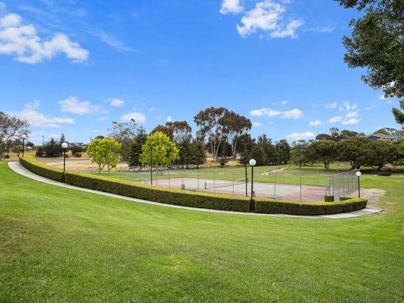 Tennis Court Surrounded By Green Space at Cypress Landing, California