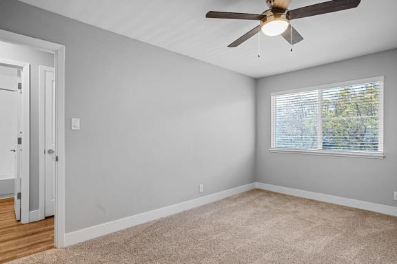 Bedroom With Ceiling Fan at Peninsula Pines Apartments, California, 94080