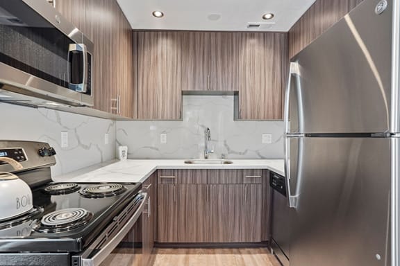 Fully Equipped Kitchen Includes Frost-Free Refrigerator, Electric Range, &amp; Dishwasher at Parkside Apartments, Davis, CA