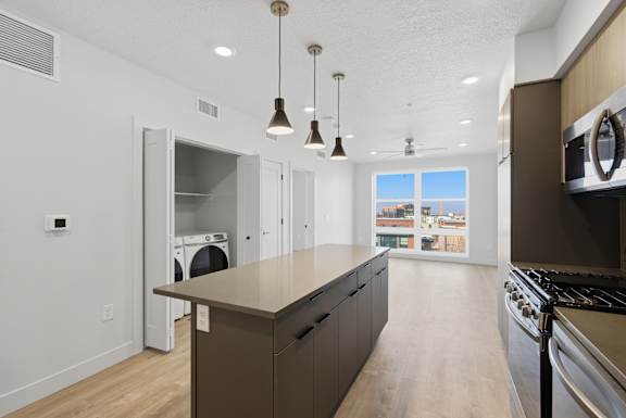 Kitchen Island with hanging lights at Brickside Heights, Millcreek